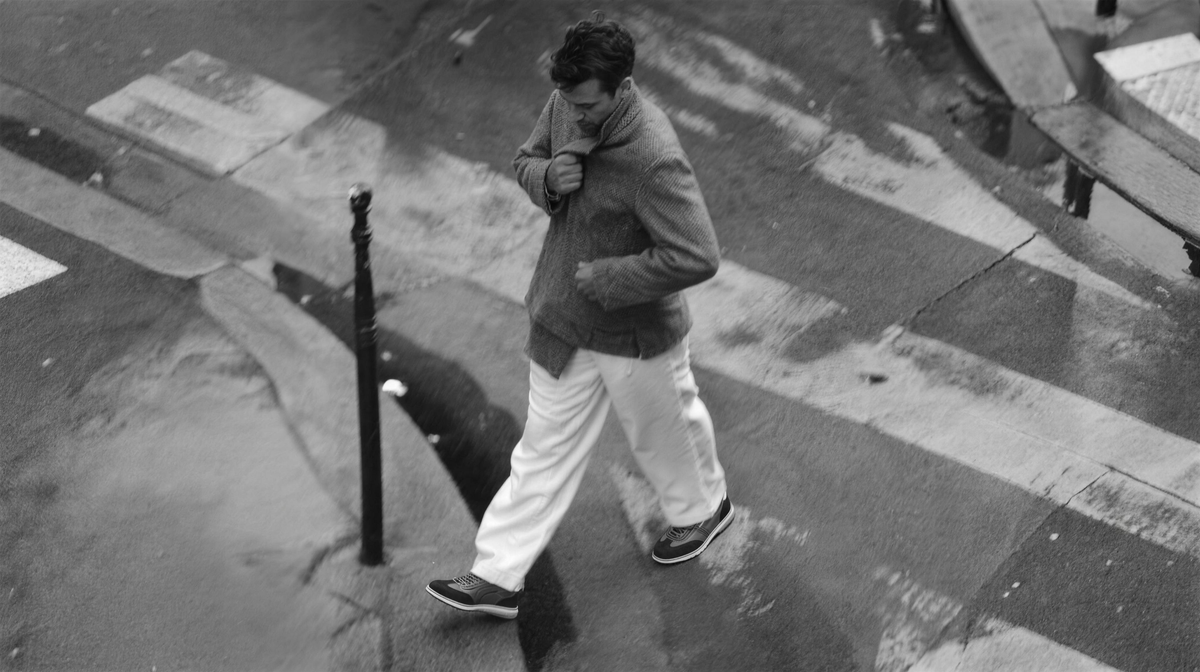 ACHILLES Men FALL 2026 hero — B&W city crossing, quilted retro