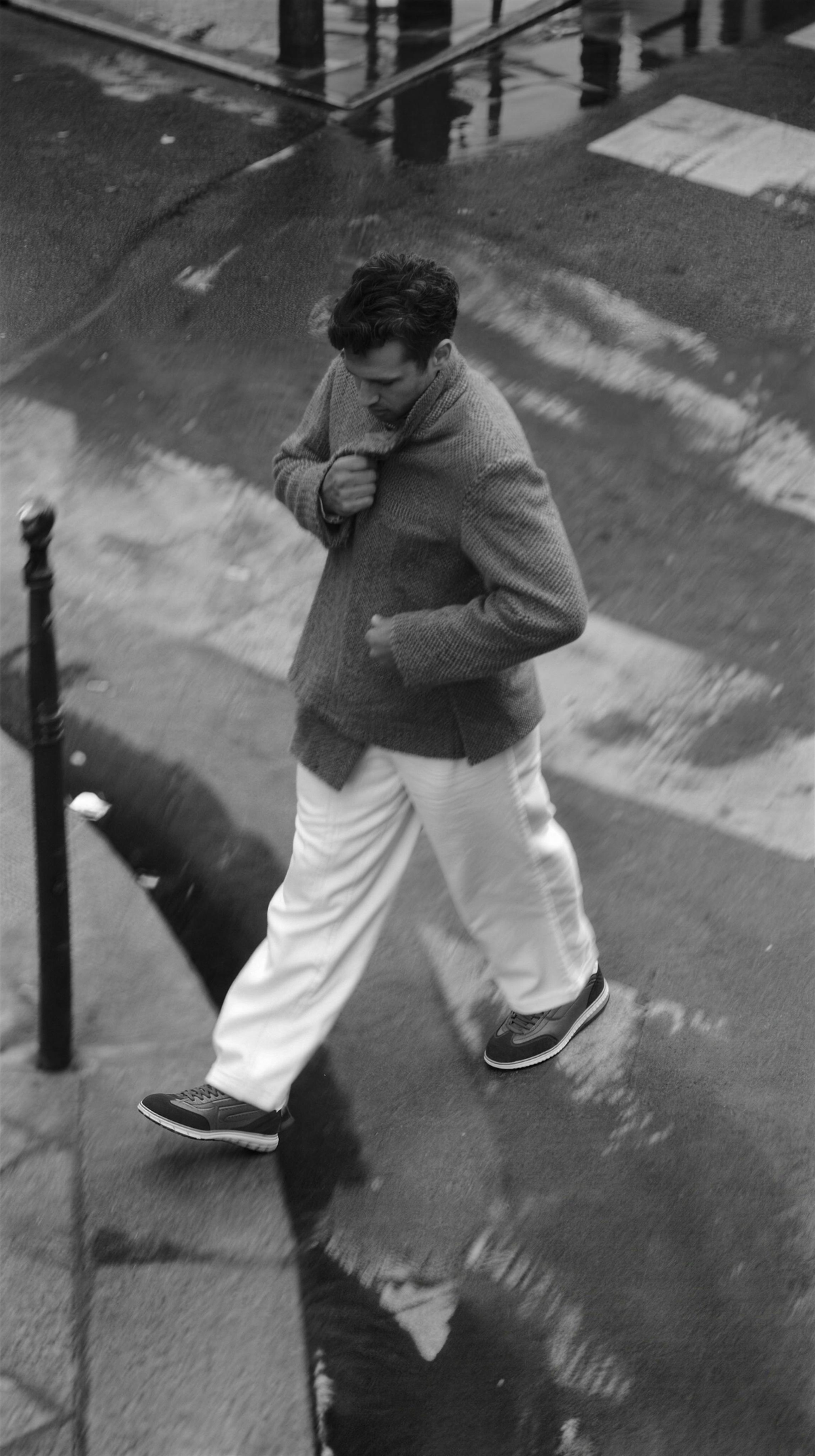 ACHILLES Men FALL 2026 mobile hero — B&W city crossing